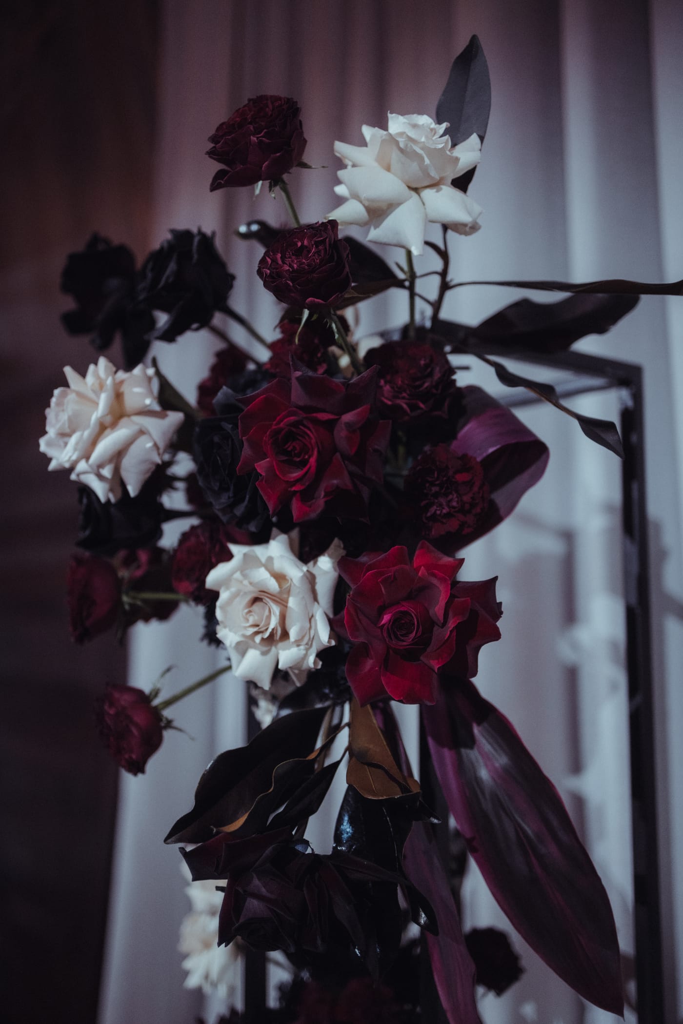 Moody burgundy and white floral arrangement by Megan, Elder Emo Weddings