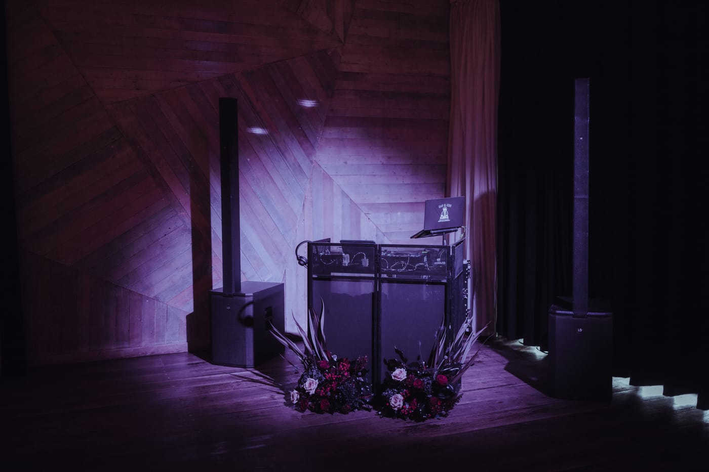 DJ booth dressed with dark florals by Megan, Elder Emo Weddings